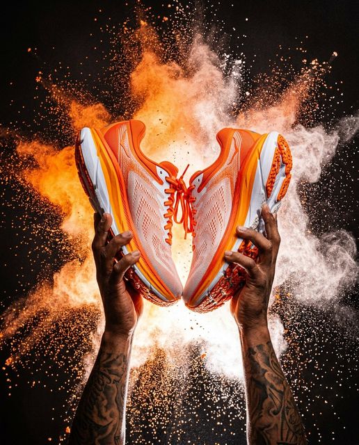 Orange running shoes powder burst